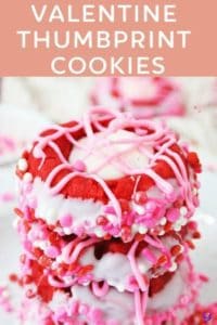 Valentine cookies with red dough, dipped in white chocolate and sprinkles, with white chocolate pink hearts, are a tasty little Valentine's Day treat!