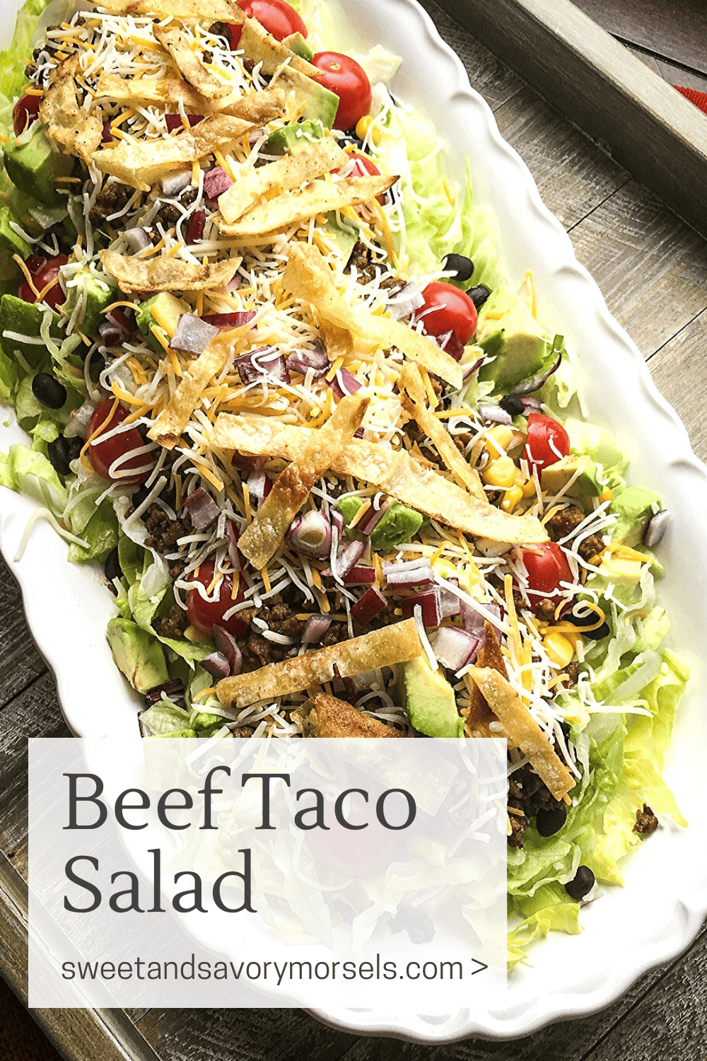 Seasoned beef, black beans, juicy grape tomatoes, creamy avocado and sweet corn,  fresh lettuce, cheese, and crispy tortilla strips are all combined to perfection in this easy Beef Taco Salad recipe.