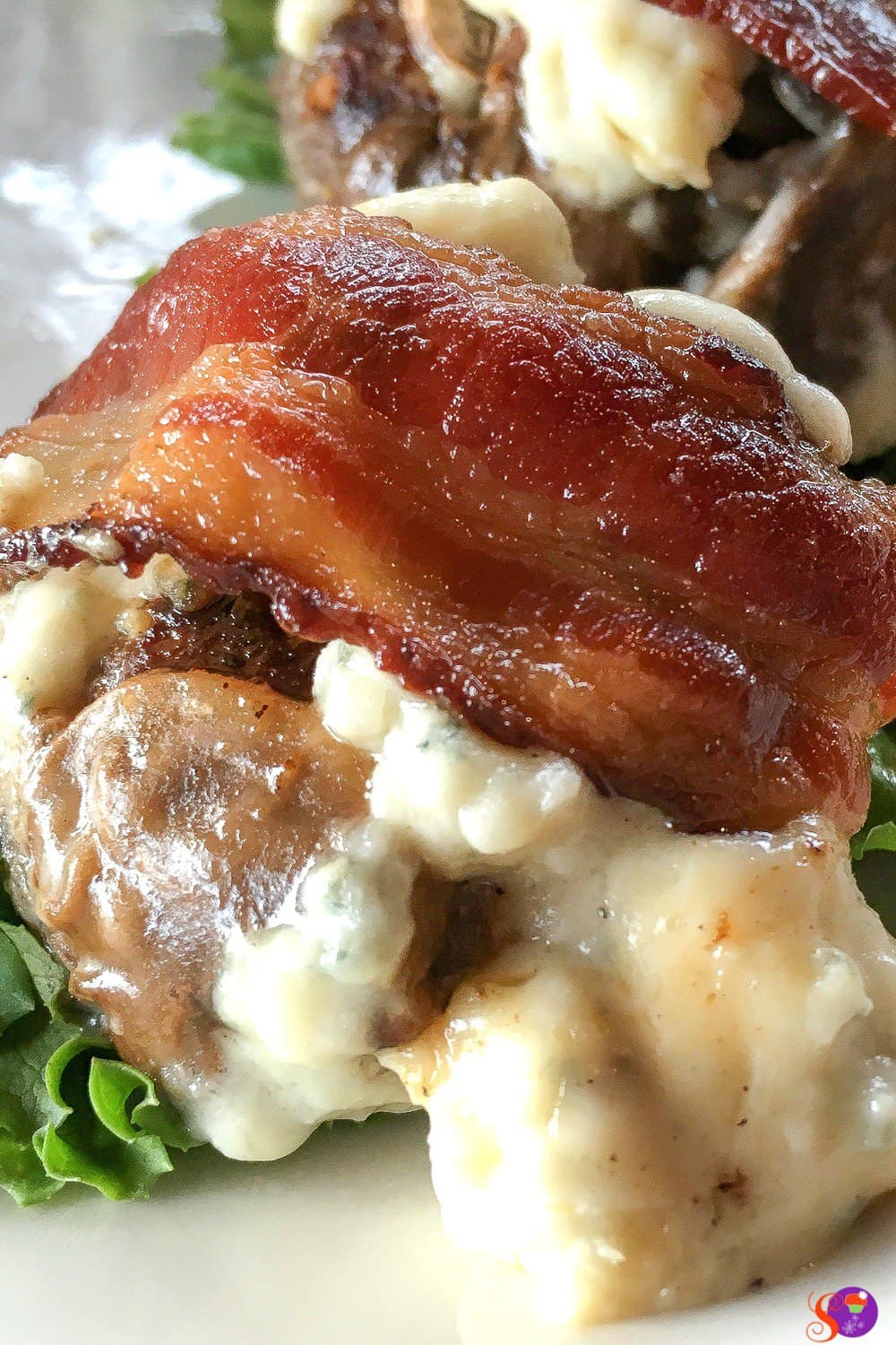 Ground beef is seasoned with garlic and onion, then formed into mini patties that are topped with melted blue cheese, sautéed mushrooms, and crispy bacon is this delicious Blue Cheese Beef Sliders recipe! 