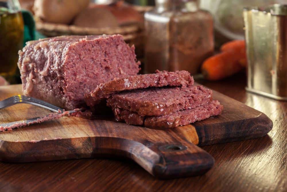 Delicious sliced corned beef on cutting board