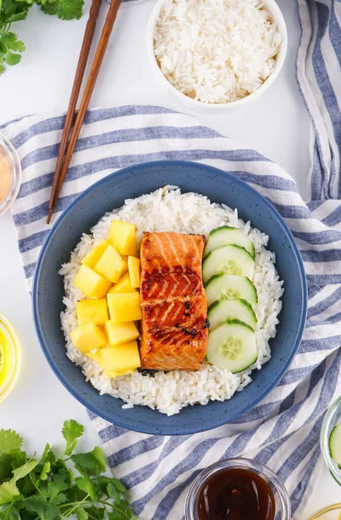 Place Mango and Cucumbers on Side of Salmon