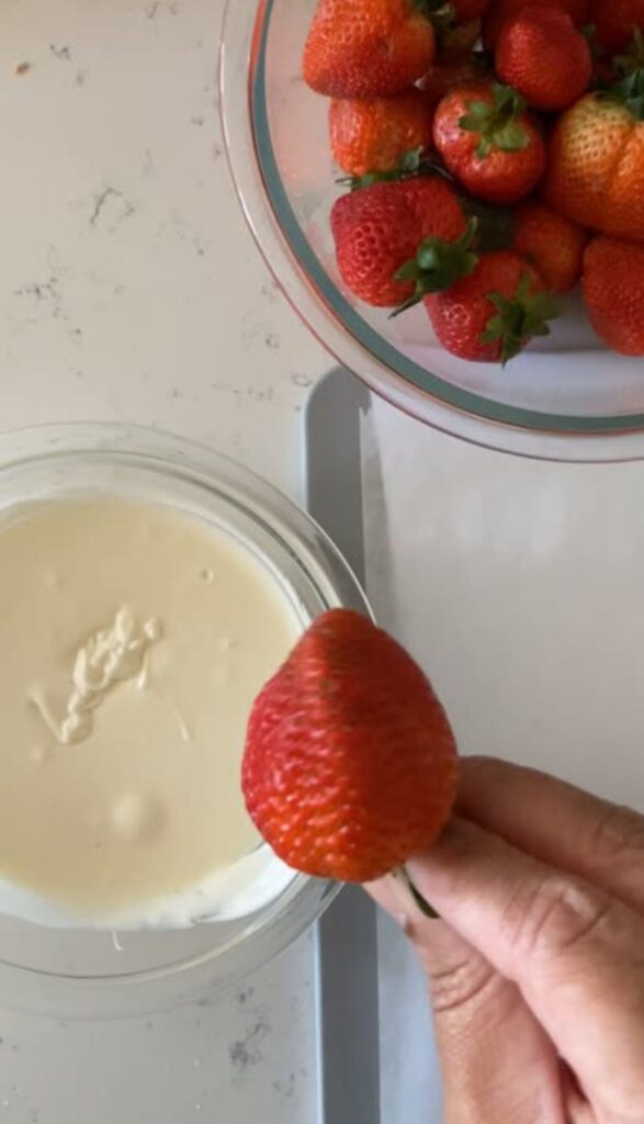 Chocolate Covered Strawberry Bunnies - Easy Easter Dessert 5 Dip your strawberries into chocolate